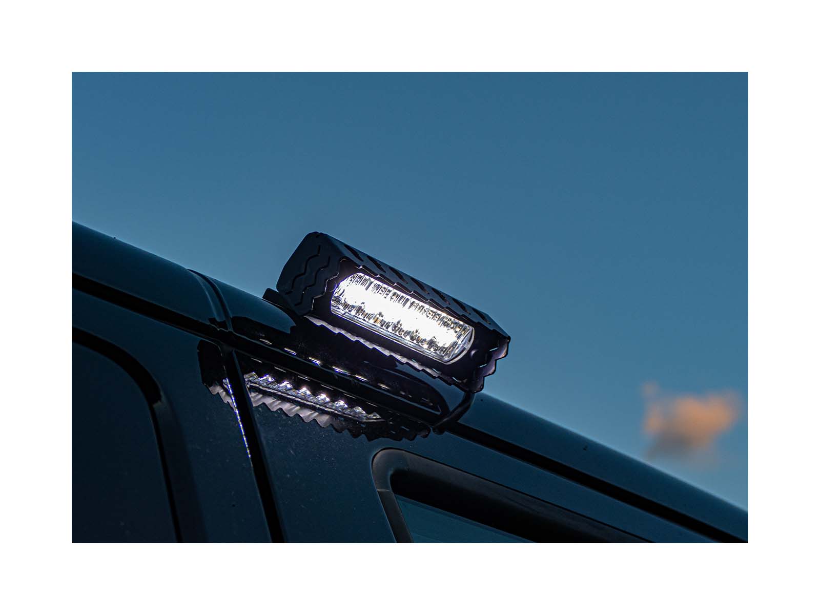 L52 Hand-Held Searchlight Lit In Situ On Vehicle at Night