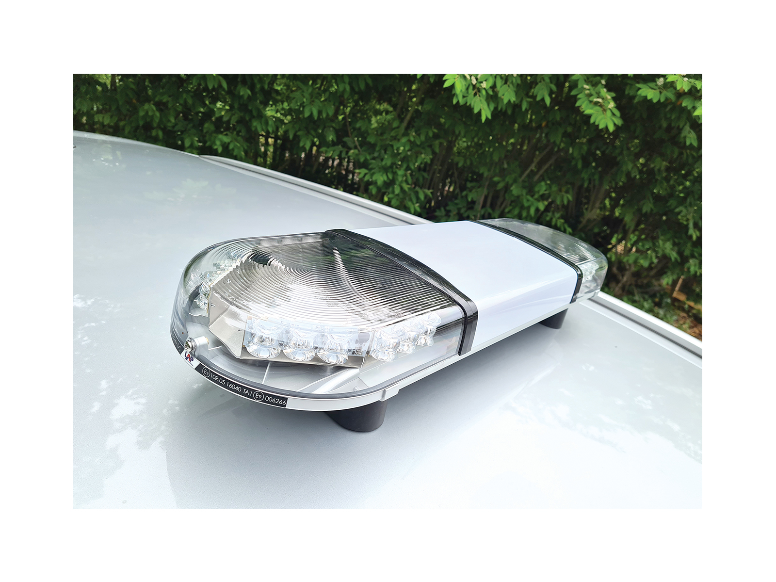 Hurricane PA Lightbar with 60 Watt Speaker Driver In Situ Angle View Unlit No Livery on Roof of Silver Car