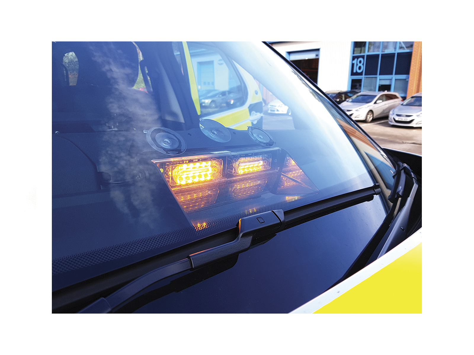 Micromax Xtreme II 12-LED Dash Light Super-Bright 6-Way Module In Situ Mounted on Dash of Traffic Officer Vehicle Close