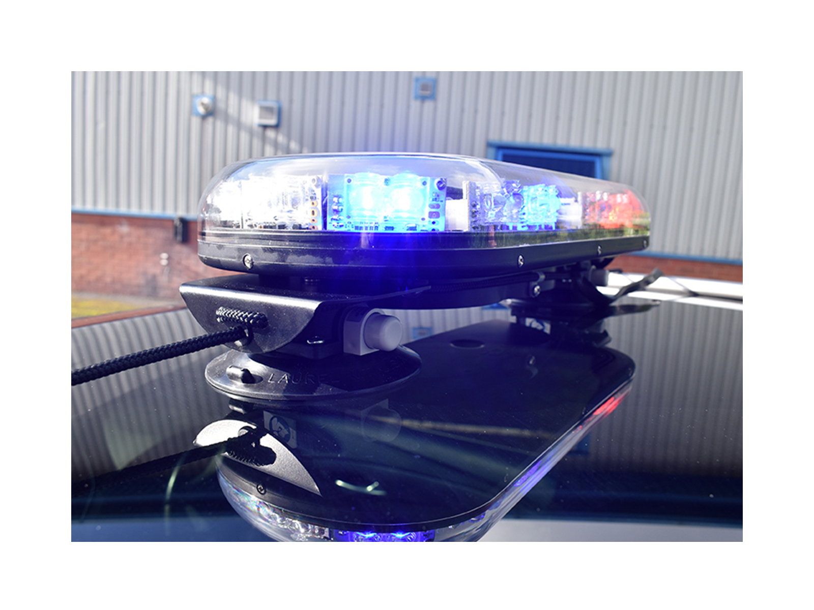 Trail Blazer 2 LED Mini Lightbar Clear Angle View Blue Red Lit In Situ on Black Car Roof 2