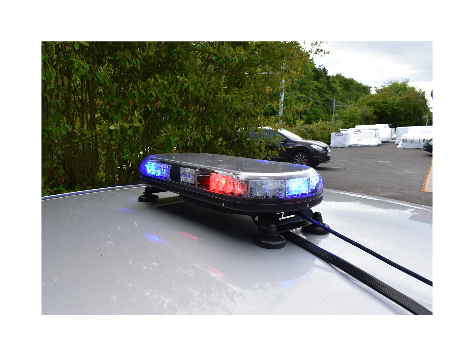 Trail Blazer 2 LED Mini Lightbar Blue Red Angle View Lit In Situ on Silver Car Roof